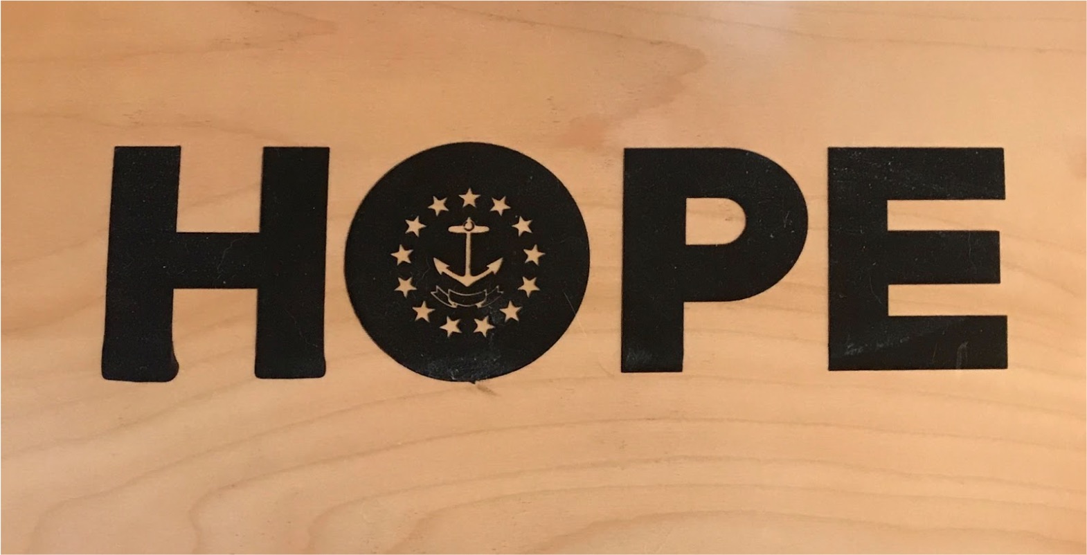 The “HOPE” plaque, one of dozens of examples of Bill’s art that his mother keeps in her living room.