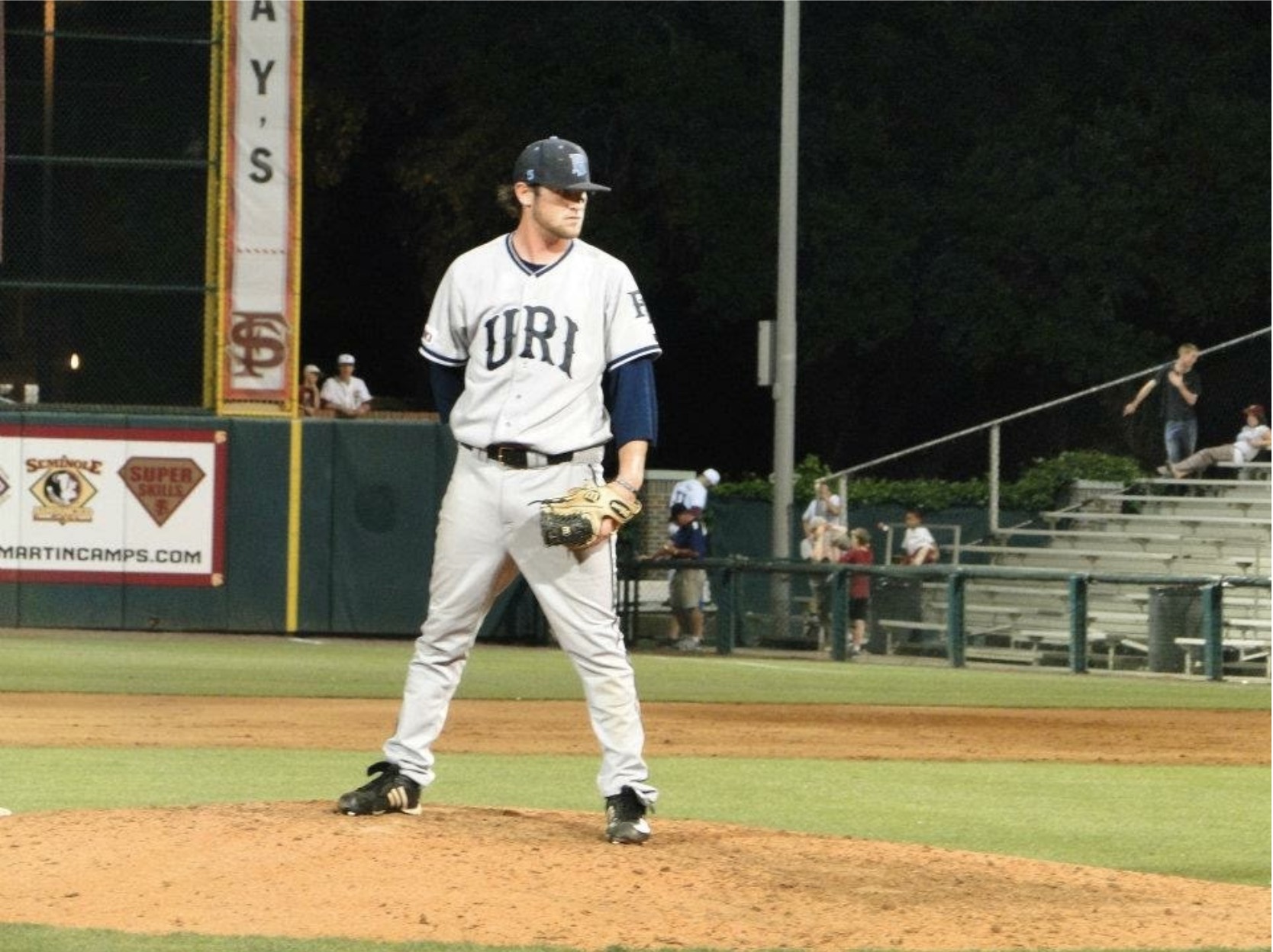 Jason pitching for the URI baseball team in 2012.