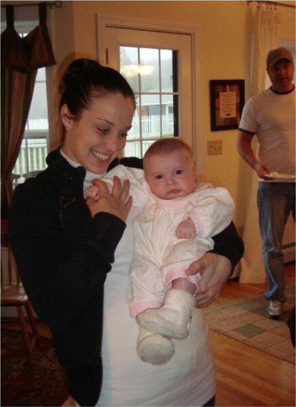 Kasia with baby Caedence at a family event in 2009.